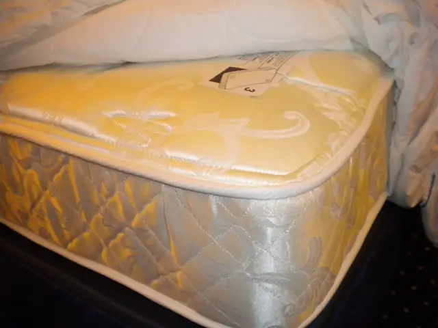 Mattress with sheets pulled back